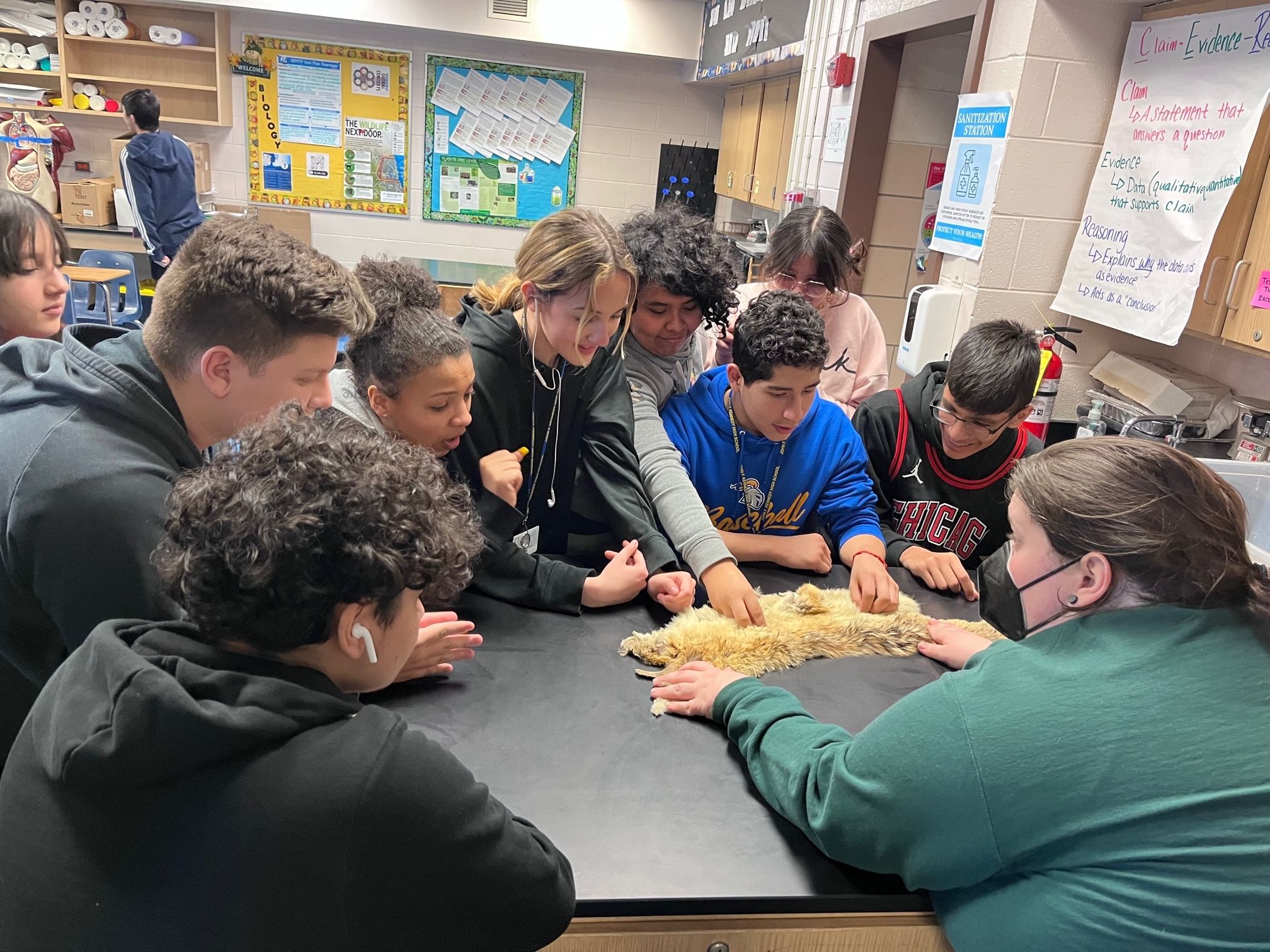 CJ in a classroom talking to students about urban wildlife