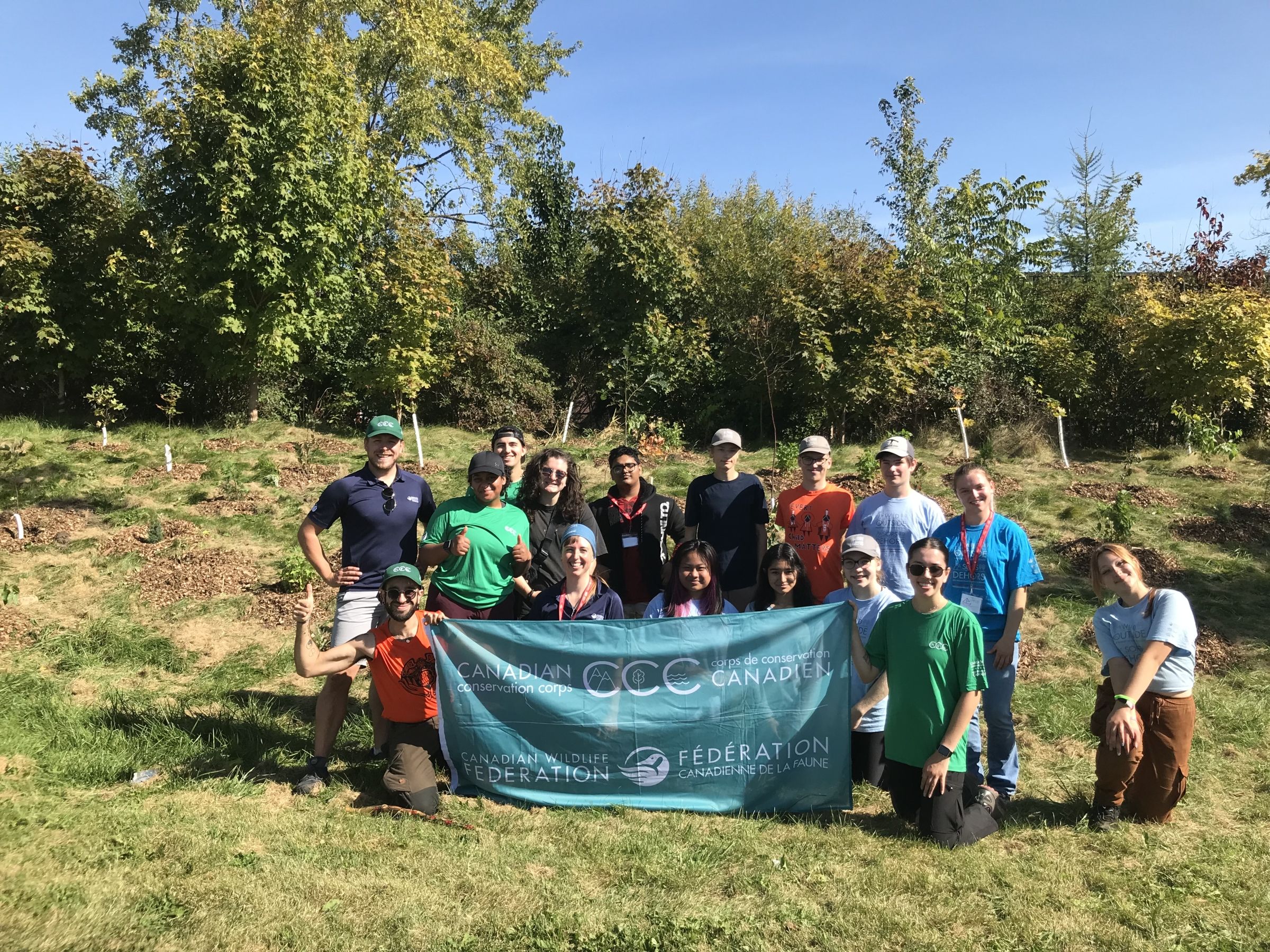 Luke at a community tree planting event with CCC Flex and WILD Outside youth participants.