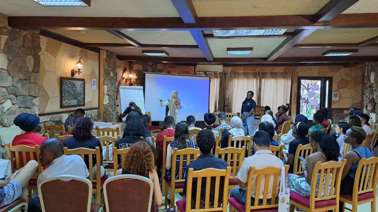 Margaret engages some youth in a climate justice camp on youth inclusion on climate decision-making processes
