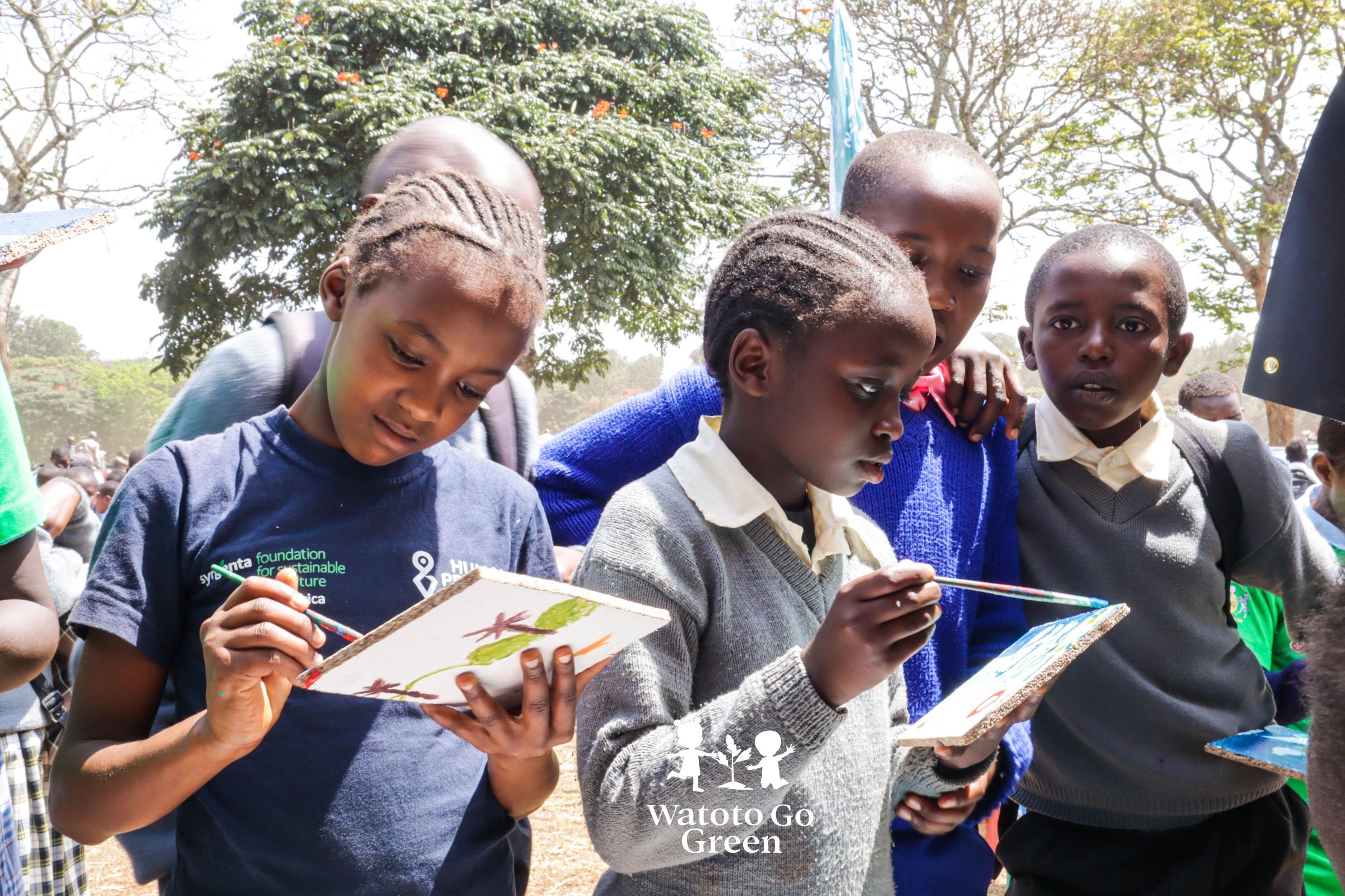 Students at a local public schools are engaged in a painting session about drawing their environment.