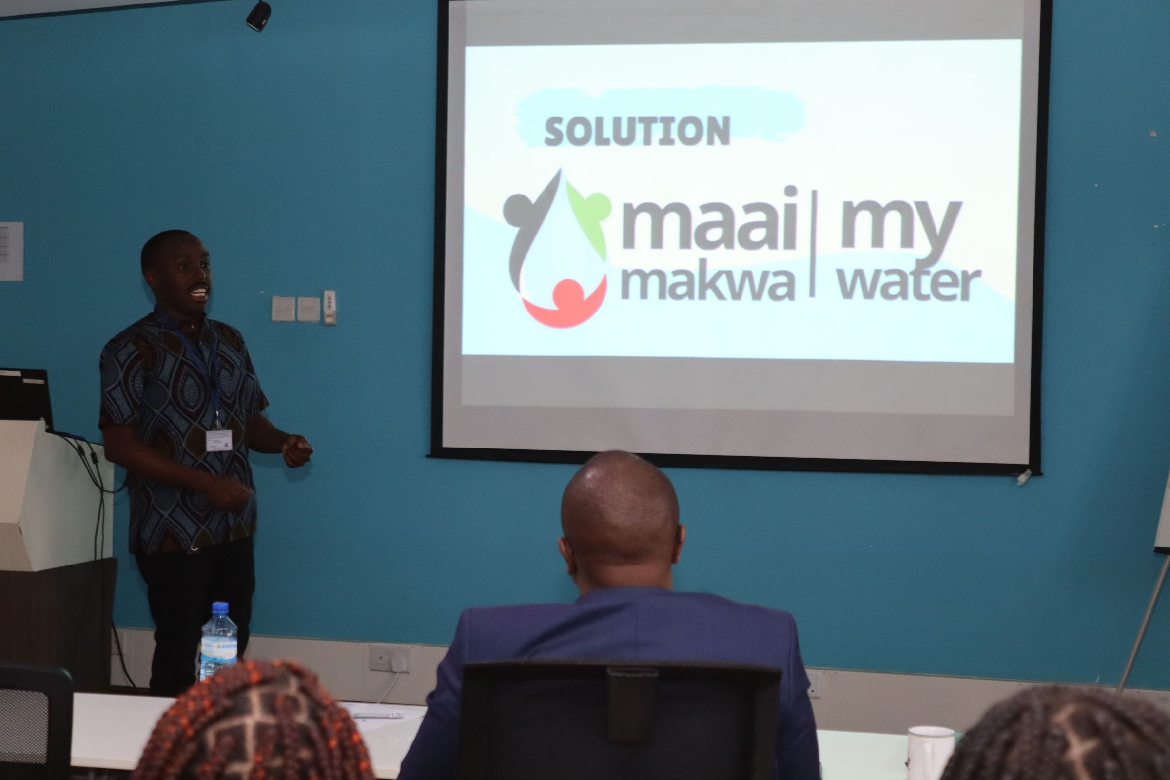 Richard presents Maai Makwa (My Water) water quality monitoring kits to the Young African Leadership Initiative Regional Leadership Centre East Africa (YALI-RLC EA) in June 2023