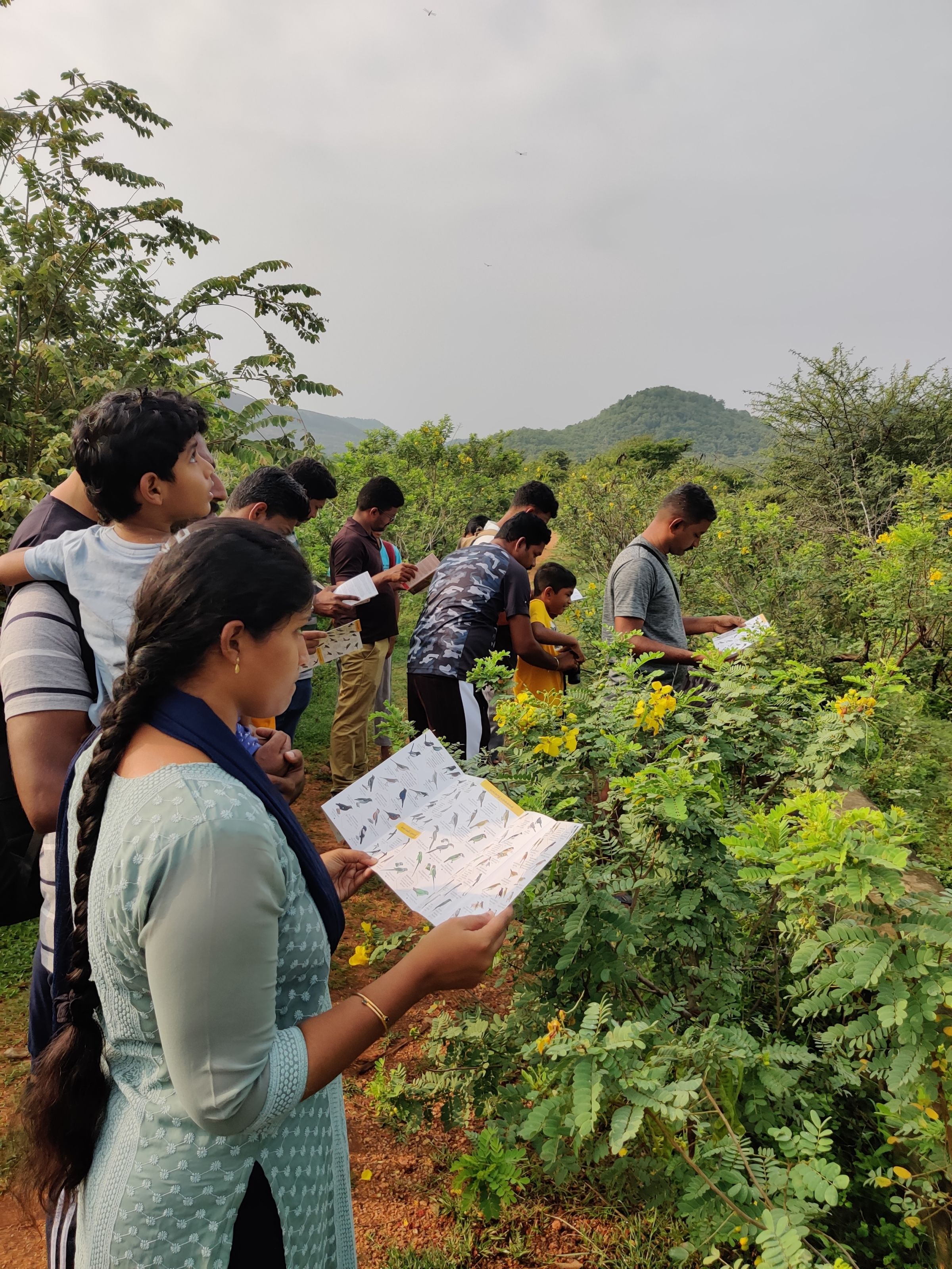Members making use of EarlyBird's common birds of Tamilnadu pamphlet during one of our bird walks