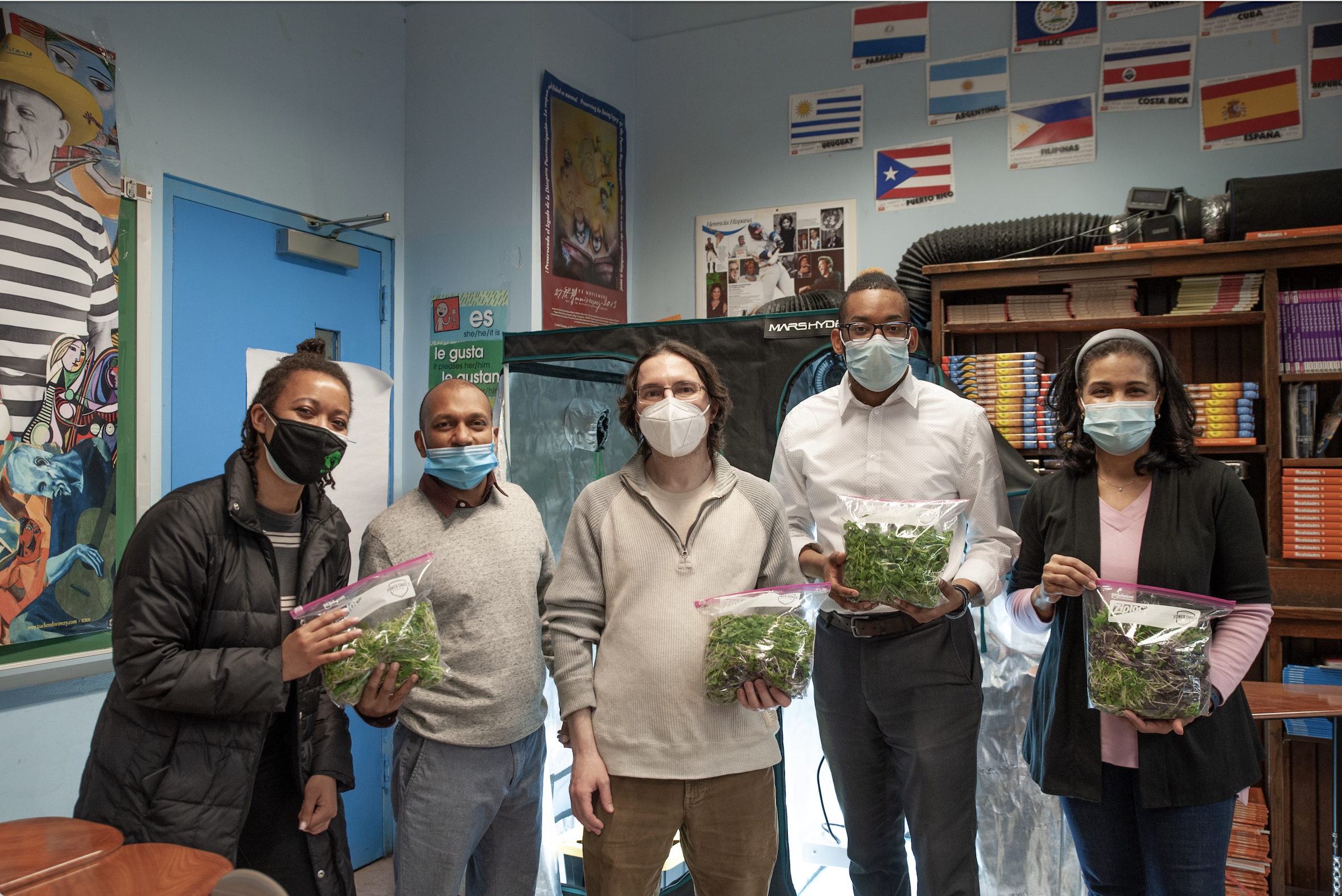  kier stands with administration from Celia Cruz High School of Music and the High School for Teaching and Professions, a cross-school collaboration to teach hydroponics and food justice led by kier while at Start:Empowerment.