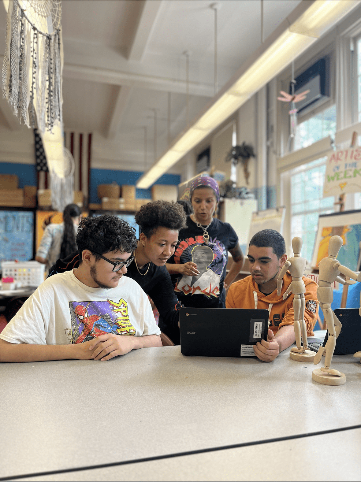 kier and guest movement artist, Ingrid Romero, offer suggestions to a student-led green team comprised of young males of color working to open up and beautify their campus green spaces.