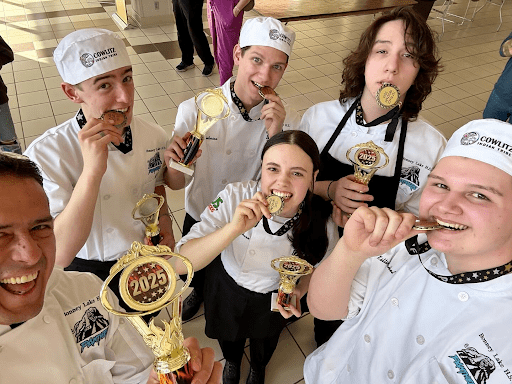 High school culinary students celebrate with award medals