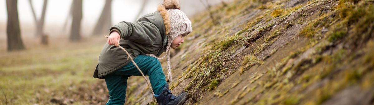 toddler playing outside in cool weather