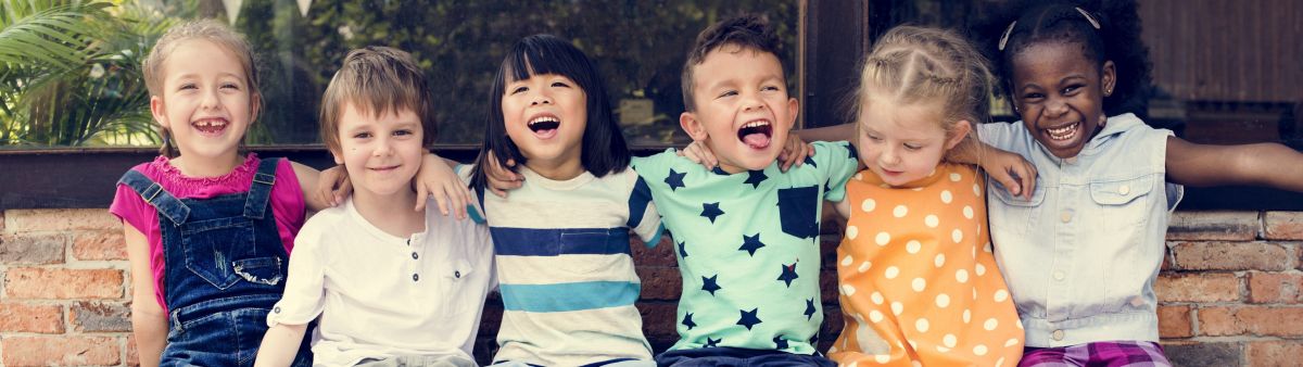 young children sitting on bench v2