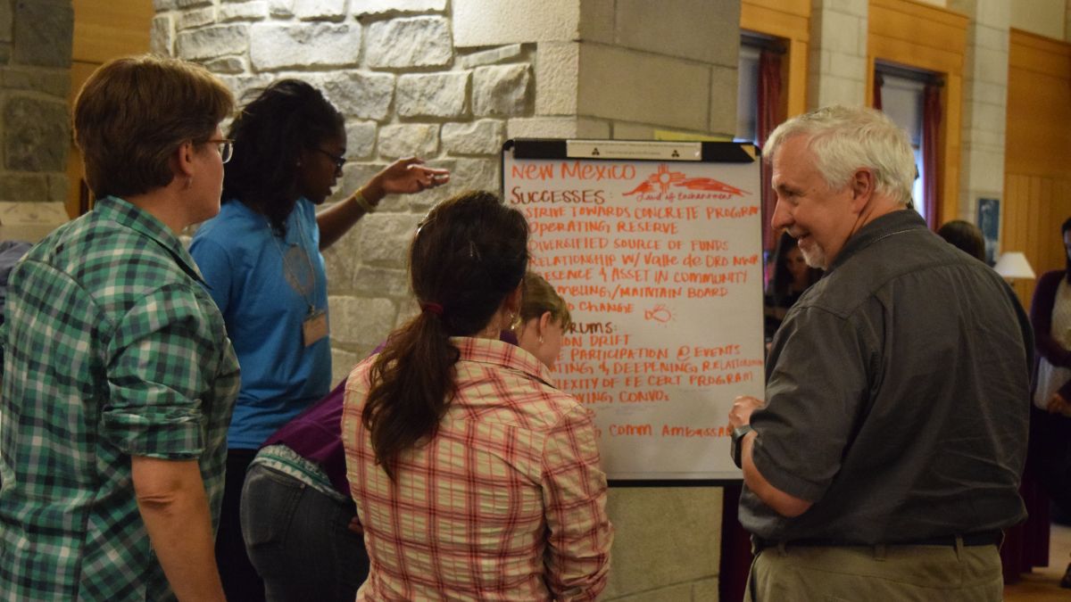 People collaborating during poster session