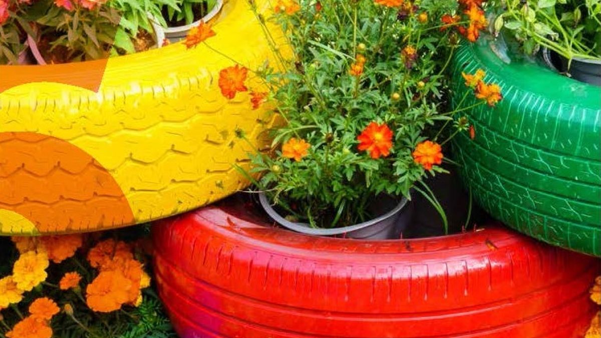 colorful painted tires with flowers planted inside