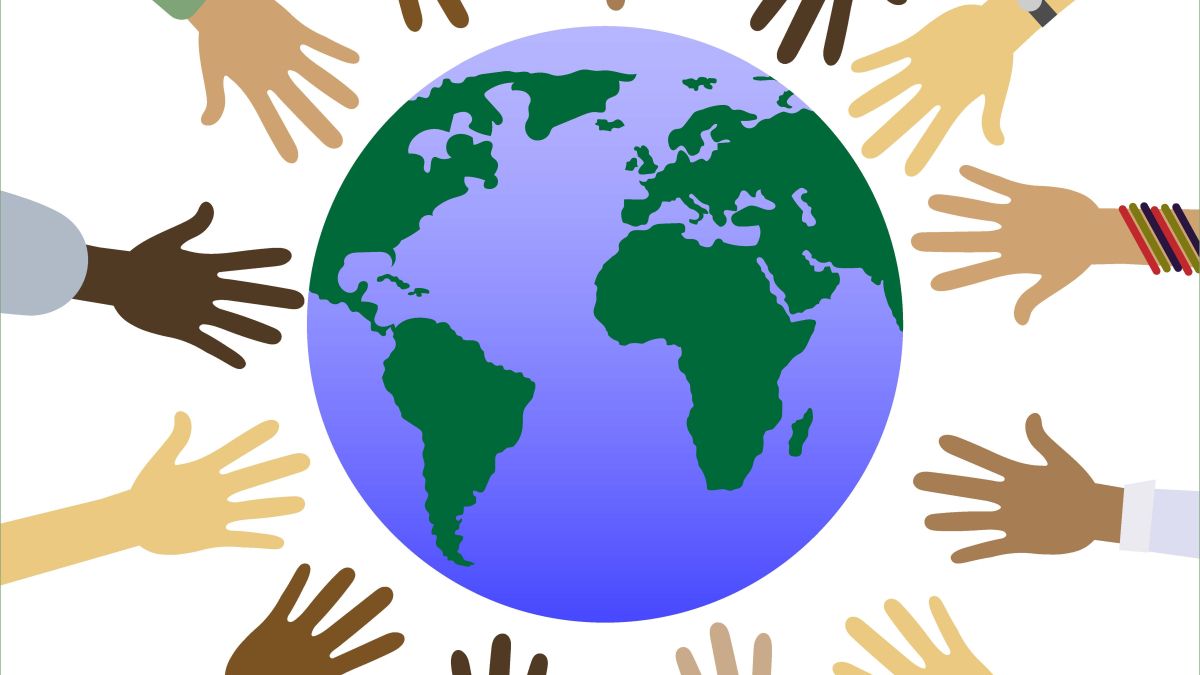 diverse group of arms reaching toward globe
