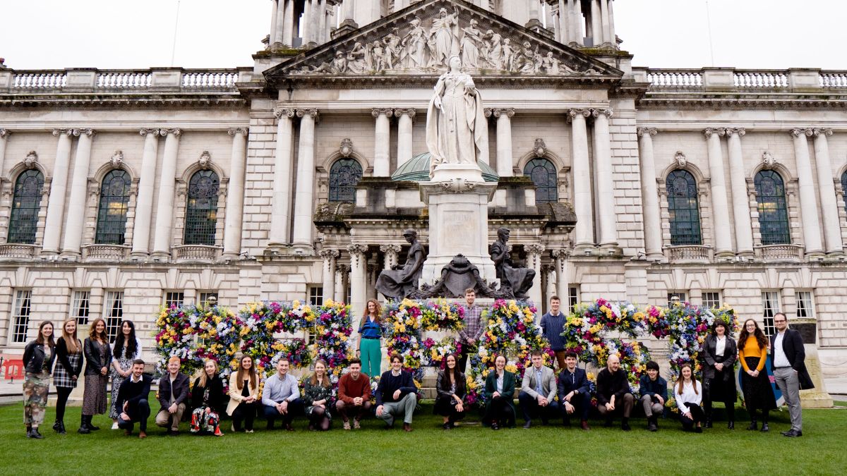 Northern Ireland 30 Under 30 posing for group photo in front of building