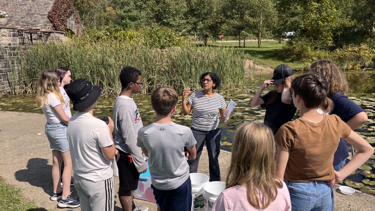 ECS Climate Action Students discuss findings from a water quality study.