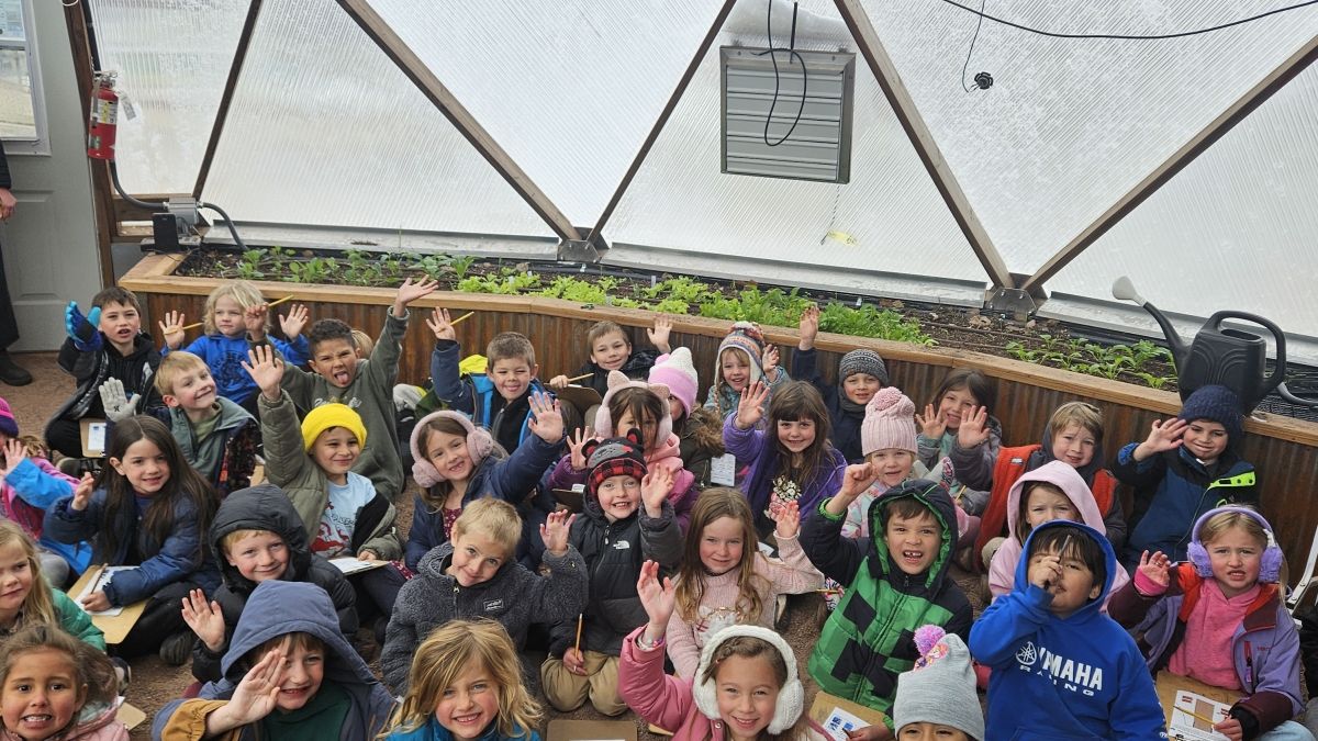 Group of kids inside a climate-protected grow dome