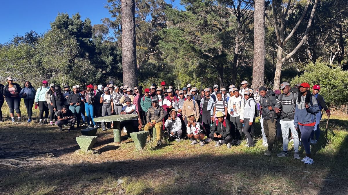 A large group of people out in nature.