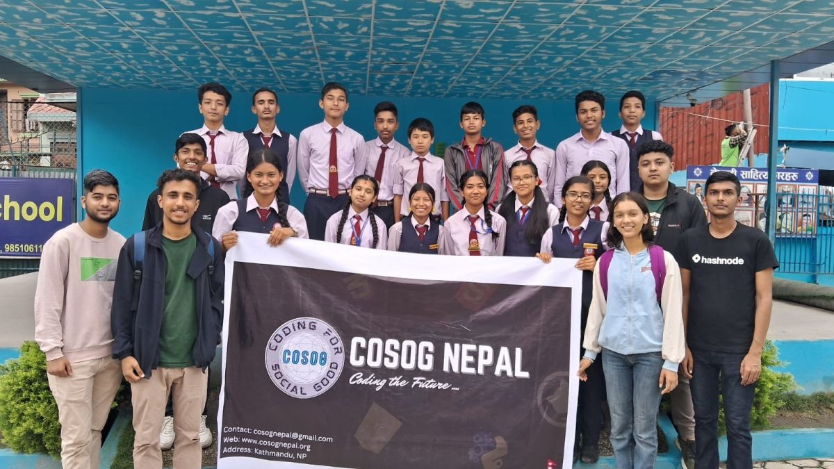 students holding up a poster and making a presentation