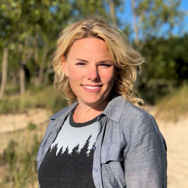 A portrait of Bridget Booth smiling at the camera