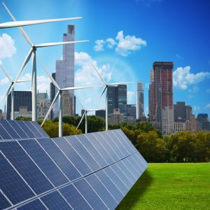 city in background with solar panels and wind mills