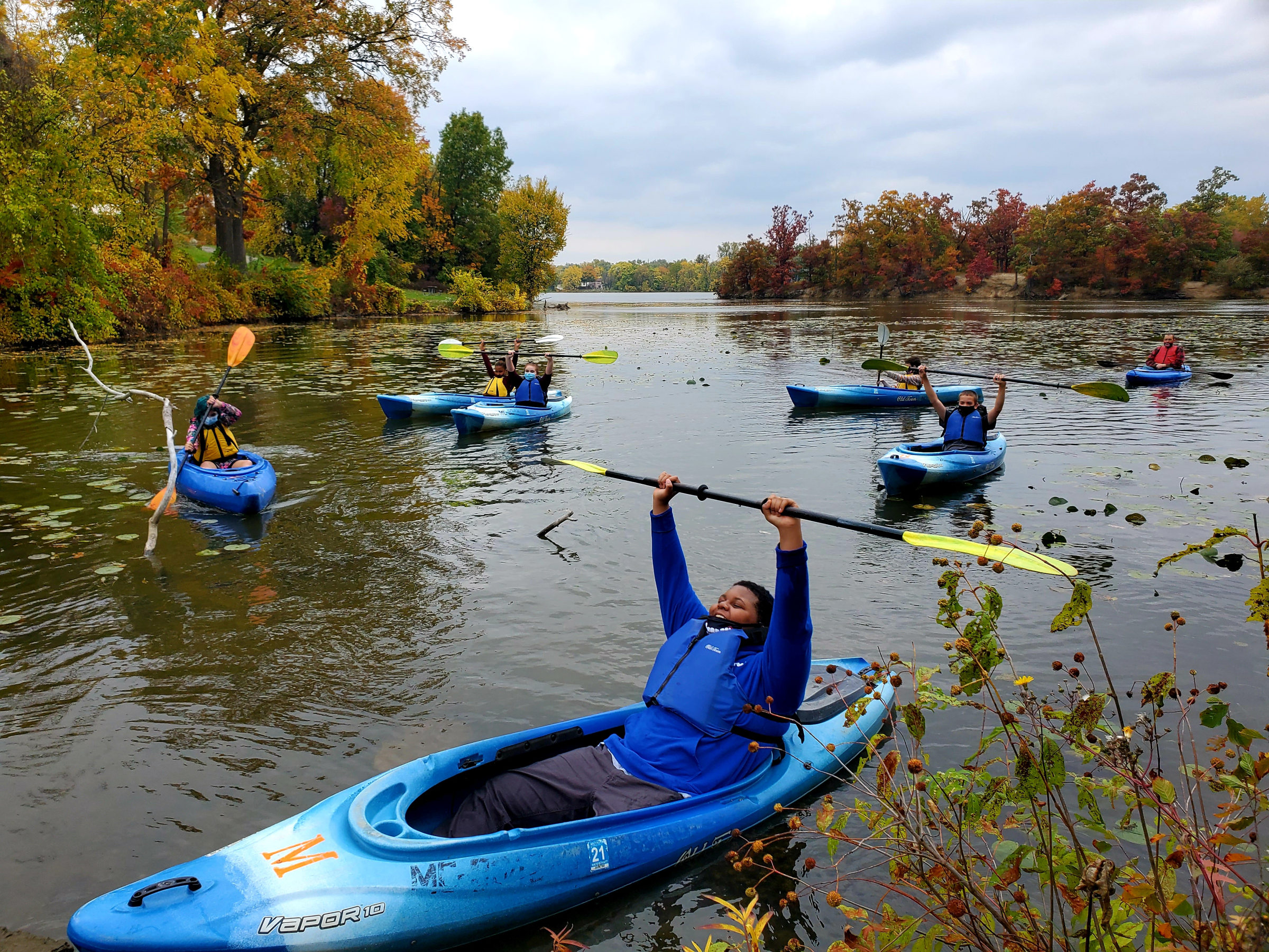 Students kayaking on river