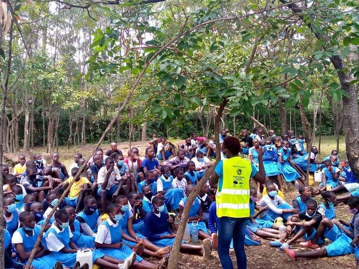 Pauline Owiti with kids at school