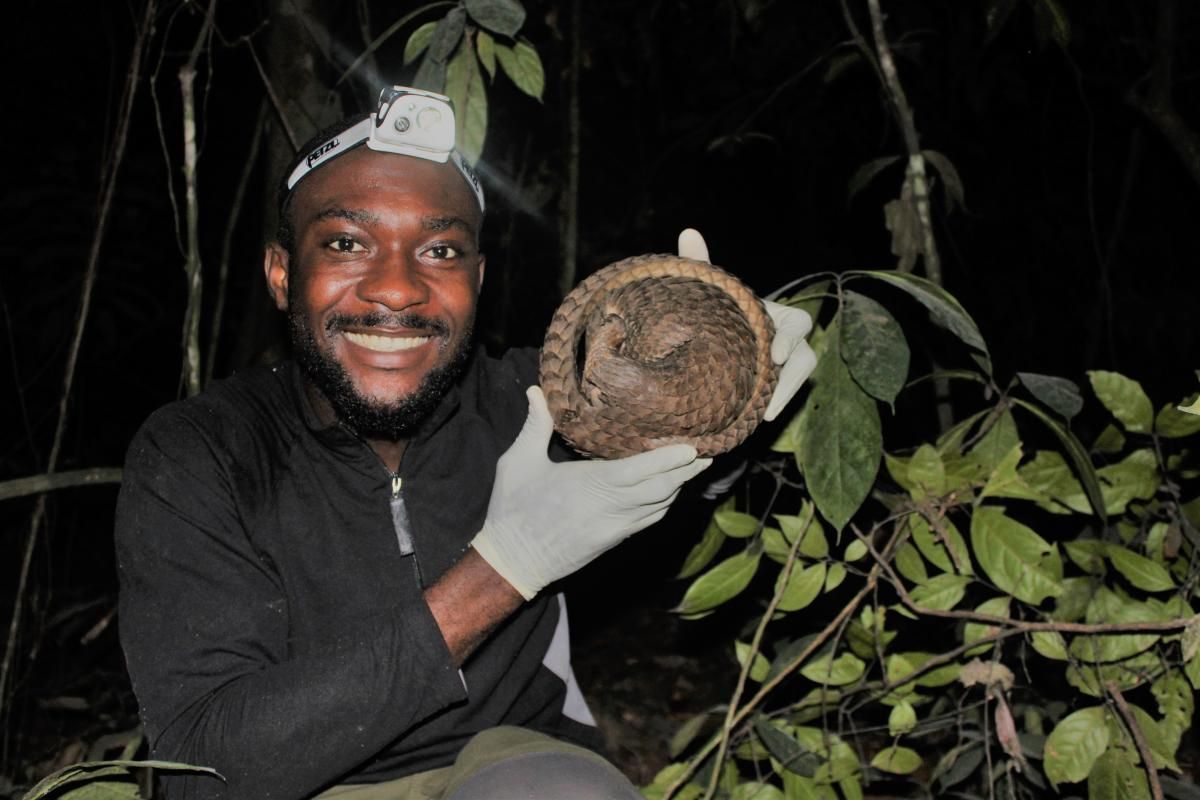 Charles Emogor with pangolin