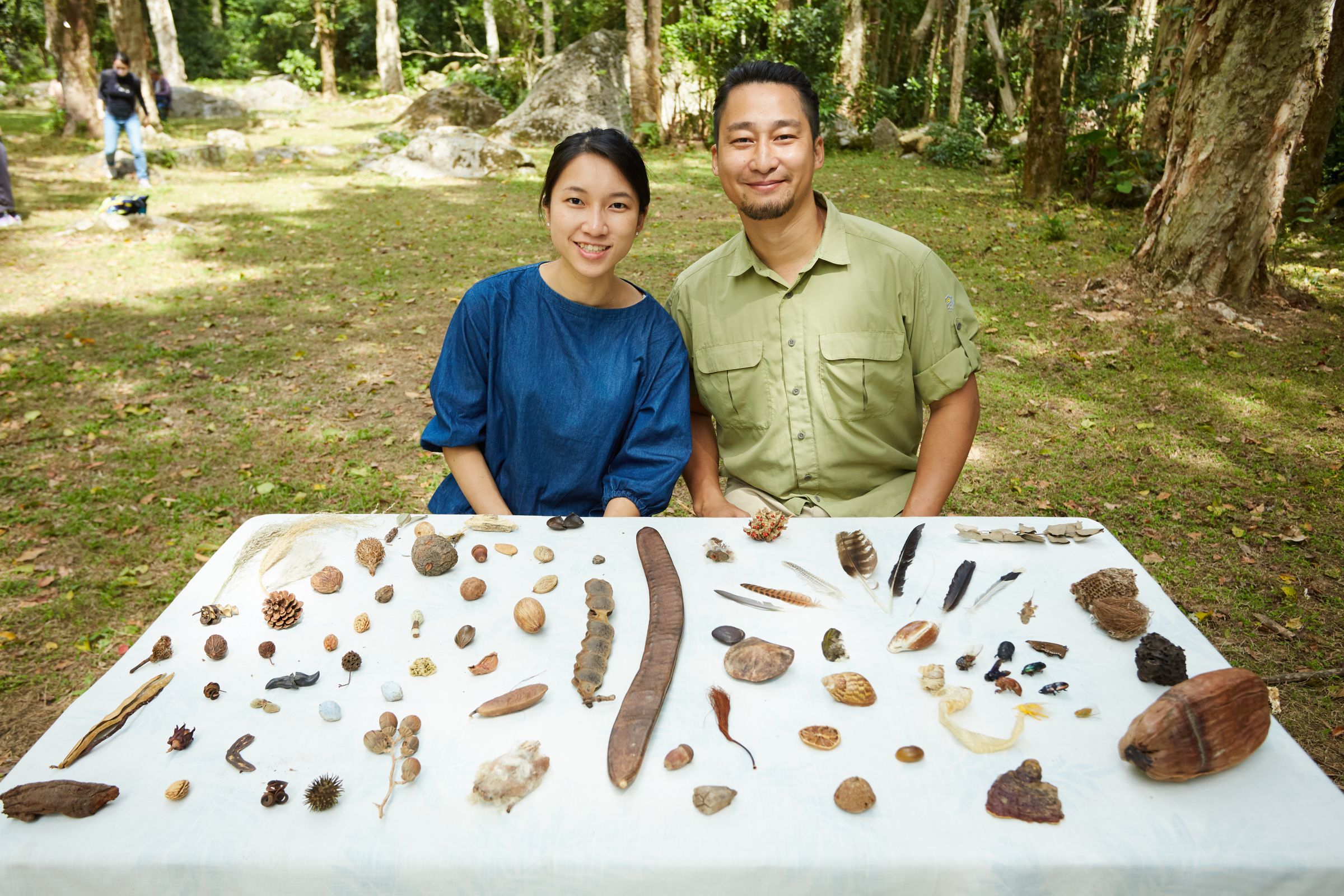 Tracy and the founder of Nature Bathing, William Tsang, educating a corporate team about biodiversity using local plant and animal specimens. Credit: Nature Bathing.