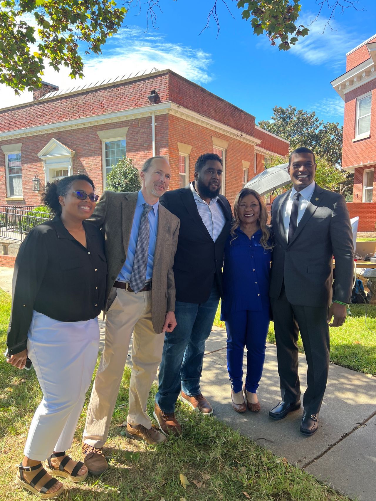  Cameron standing with EPA Administrator Michael Regan and leaders from Appalachian Voices, the Rural Beacon Initiative, and the Center for Rural Enterprise and Environmental Justice at the landmark announcement of the EPA’s new Office of Environmental Justice and External Civil Rights.