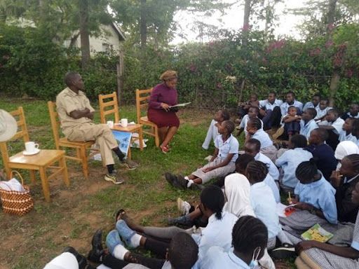 Utilising the power of storytelling. Reading ' The Great Kapok Tree' to students of Ol Jogi Primary School during a lesson on interconnectedness.