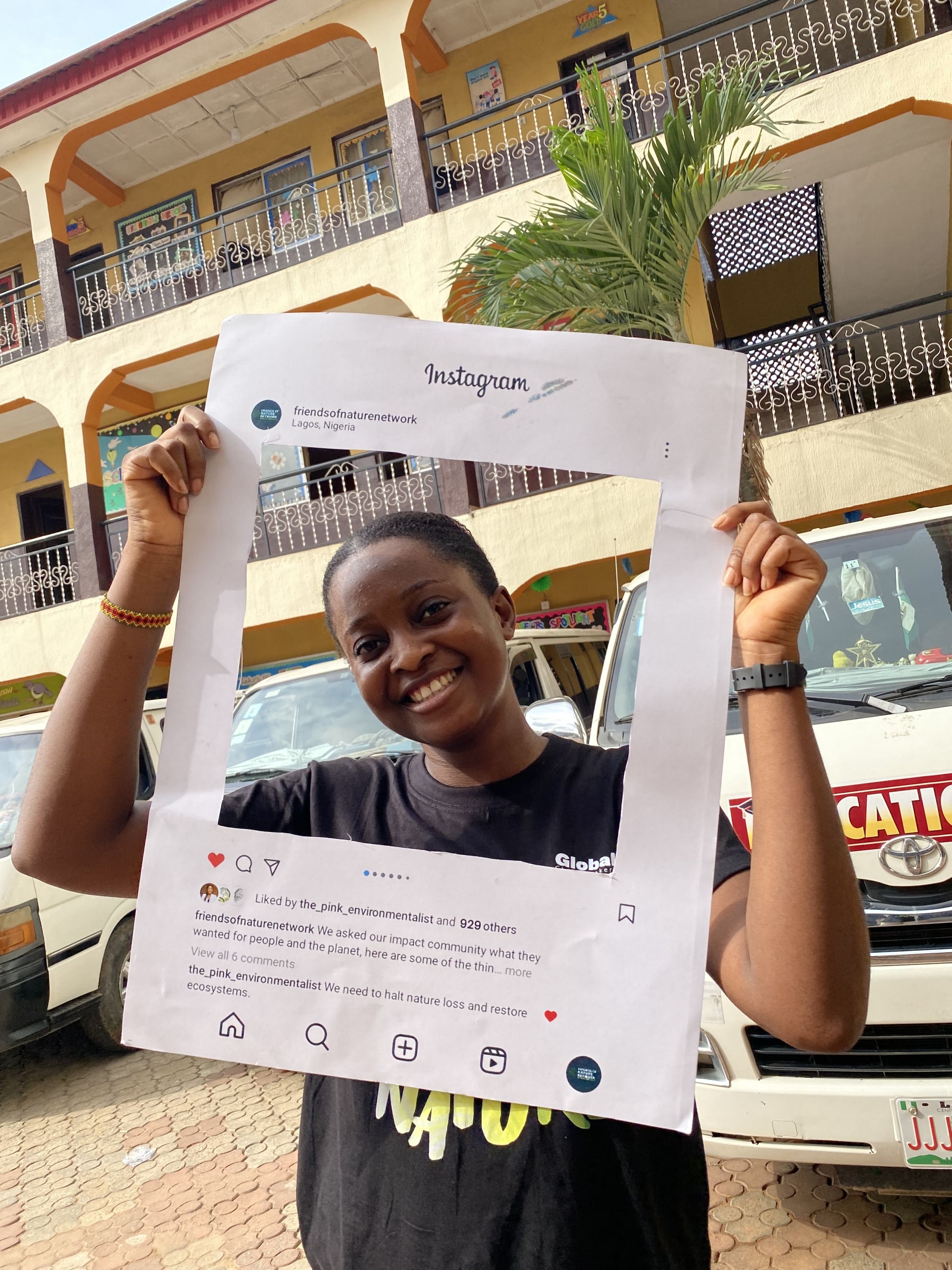 Favour taking a picture with a campaign material after a school workshop.