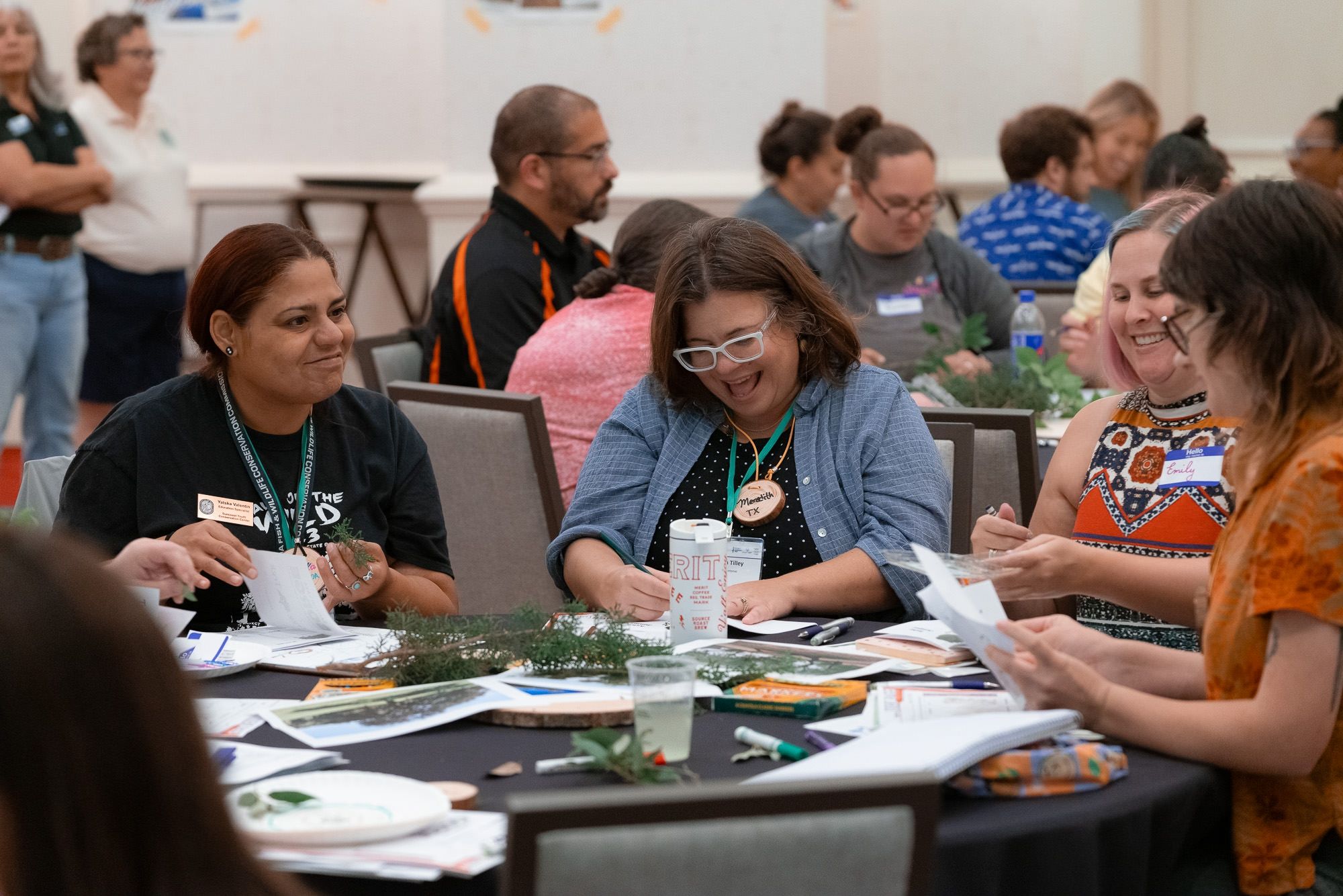 A group of people participate in a Project Learning Tree training.