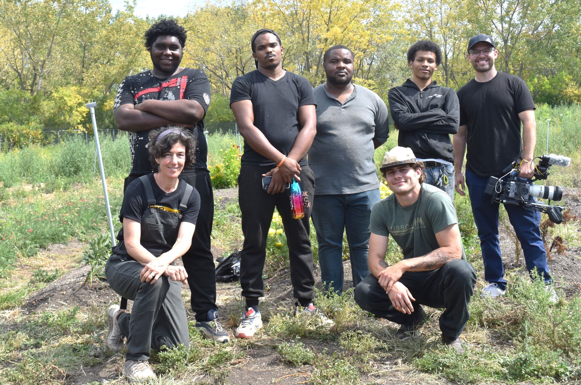 Juliet Grable and James Parker stand with young adults while filming In Our Nature in Lexington, Kentucky