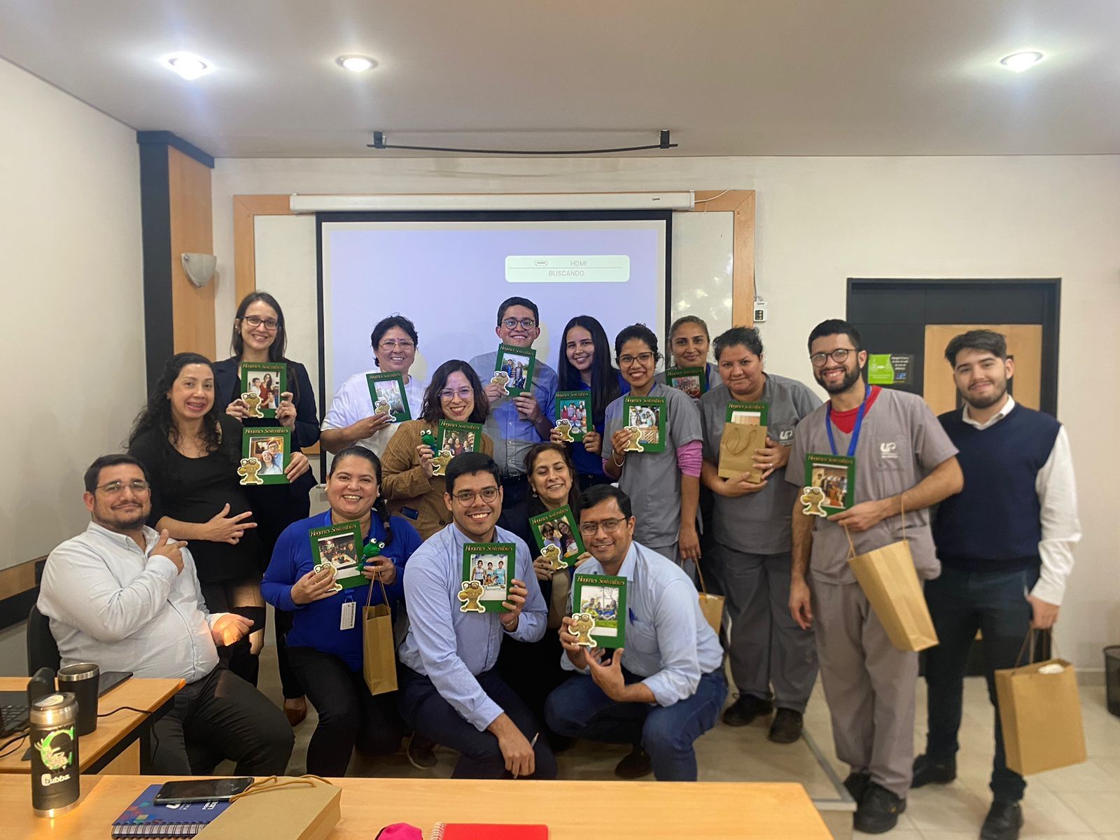 Professor and students posing in front of the classroom