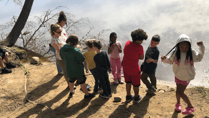 Kids next to a river